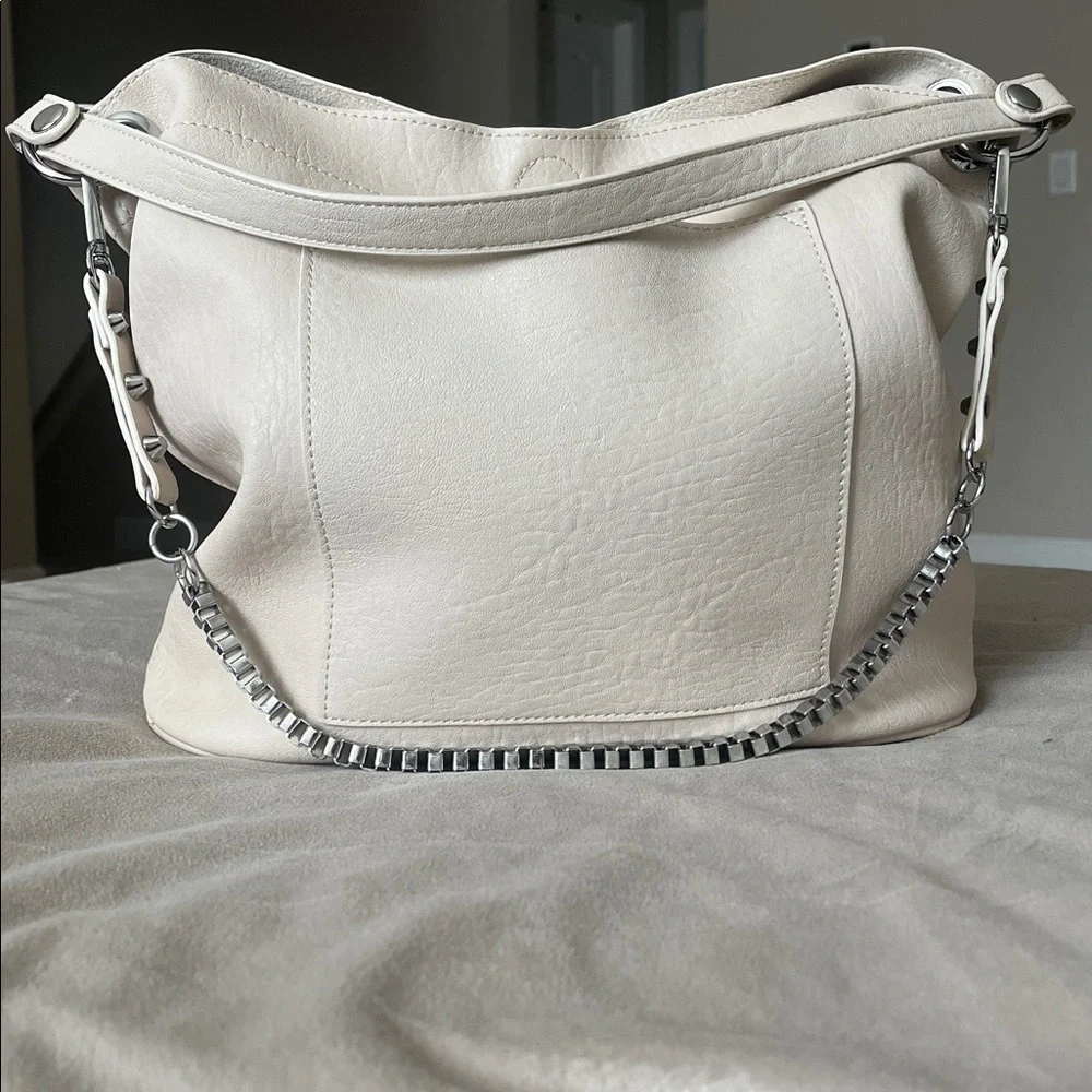 Madison West Purse in a purse
Cream purse w/ silver details. - Picture 1 of 6